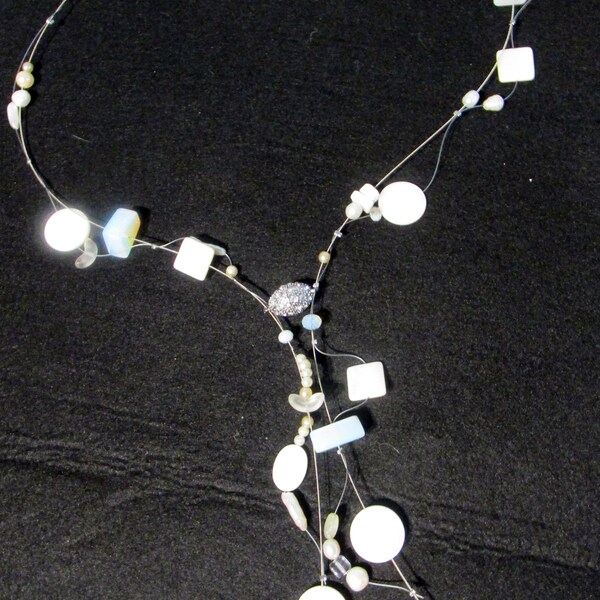 Emily, guitar strings, shells, pearls, abstract, front magnetic closure, matinee length, contemporary