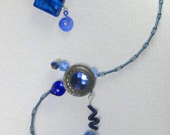 Velvet, wraparound style, royal blue glass, metals, asymmetrical, contemporary, silver,
