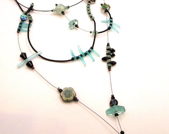 Aqua, black, rubber, glass daggers, statement necklace, elegant and sophisticated, contemporary, adjustable, Gwynneth
