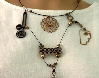 Brass sculptural necklace, boho, asymmetrical, face, medallion, reclaimed metals, back magnetic closure, Ava
