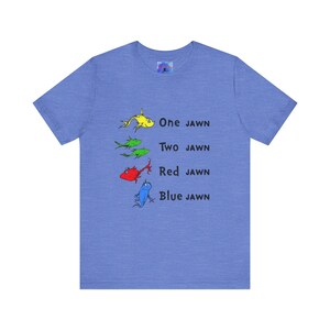 May include: A blue t-shirt with a graphic of four fish in different colors and the text "One Jawn, Two Jawn, Red Jawn, Blue Jawn".