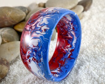 Bangle bracelet handcrafted from recycled surfboard resin