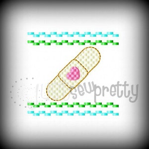 May include: A white bandage with a pink heart in the center. The bandage is on a white background with two rows of green and blue squares.