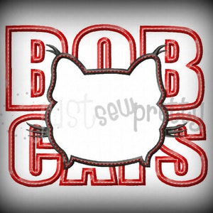 Può includere: Design ricamato rosso con il testo "BAD GALS" e una silhouette di gatto in bianco e nero al centro.