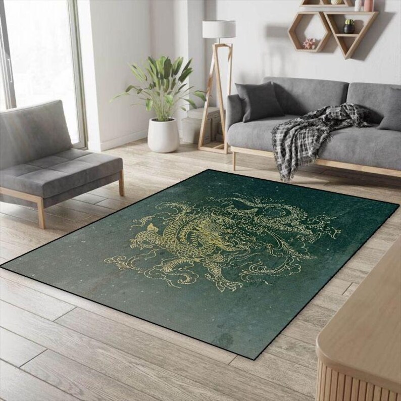 May include: A green and gold area rug with a dragon design. The rug has a faded, vintage look and is perfect for adding a touch of Asian-inspired style to your home.