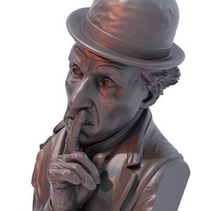 May include: A bronze-colored bust of a man wearing a fedora and a coat, with his index finger pressed to his lips in a gesture of silence. The sculpture has detailed facial features and a classic style.