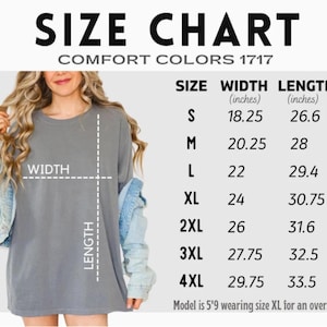 May include: Size chart for Comfort Colors 1717 apparel, with measurements in inches. Sizes range from S to 4XL, with width measurements from 18.25 to 29.75 inches and lengths from 26.6 to 33.5 inches. Model is 5'9 wearing size XL for an oversized fit.