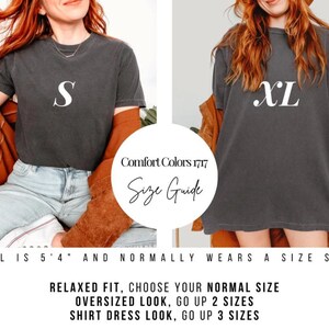 May include: Two women wearing dark gray t-shirts with white size labels, "S" and "XL". The image includes a size guide with text: "Comfort Colors 1717 Size Guide". The text below reads: "Relaxed fit, choose your normal size. Oversized look, go up 2 sizes. Shirt dress look, go up 3 sizes."