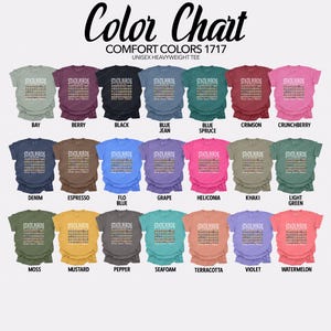 May include: Color chart showing 18 different colors of unisex heavyweight t-shirts. The chart shows the color names for each shirt, such as Bay, Berry, Black, Blue Jean, Blue Spruce, Crimson, Crunchberry, Denim, Espresso, Flo Blue, Grape, Heliconia, Khaki, Light Green, Moss, Mustard, Pepper, Seafoam, Terracotta, Violet, and Watermelon.