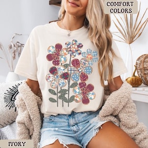 May include: A handmade wooden chopping board with a natural finish. The board has a live edge on one side and a smooth, rectangular shape. It is approximately 45 cm long and 30 cm wide.