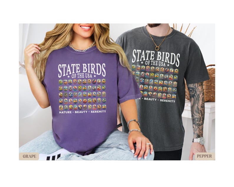 May include: Two people wearing purple and gray t-shirts with a graphic of all the state birds of the USA. The text on the shirts reads "State Birds of the USA".