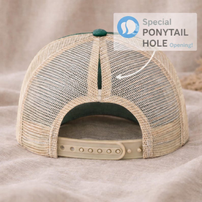 May include: A green and tan trucker hat with a mesh back and a ponytail hole opening. The hat has an adjustable strap and a green button on top. The text "Special PONYTAIL HOLE Opening!" is visible.