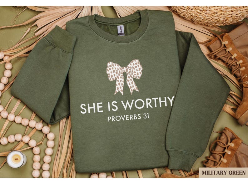 a green shirt with a bow on it