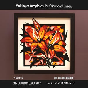 May include: A framed 3D layered wall art piece depicting a lily in shades of orange and yellow. The artwork, with seven layers, is set against a white background within a black frame. The text at the top reads "Multilayer templates for Cricut and Lasers".