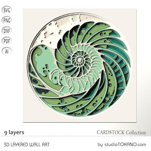 Puede incluir: Un diseño de arte de pared en 3D con capas que presenta una concha de nautilus con un patrón en espiral en tonos verdes y blancos. El diseño está hecho de cartulina y tiene 9 capas.