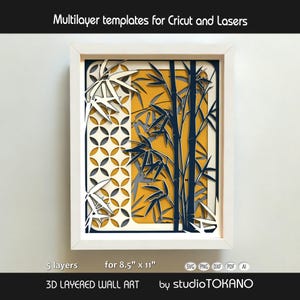 May include: A 3D layered wall art piece featuring bamboo stalks and a geometric circle pattern in navy blue, white, and mustard yellow. The framed artwork consists of 5 layers designed for 8.5" x 11" cutting machines. Text reads: Multilayer templates for Cricut and Lasers, 5 layers, for 8.5" x 11", 3D LAYERED WALL ART, by studioTOKANO.