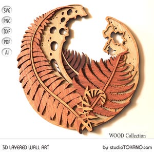 May include: A 3D layered wall art piece featuring a fern design in shades of brown and red. The design is layered to create a dimensional effect. The art piece is made of wood and is part of the WOOD Collection by studioTOKANO.com.