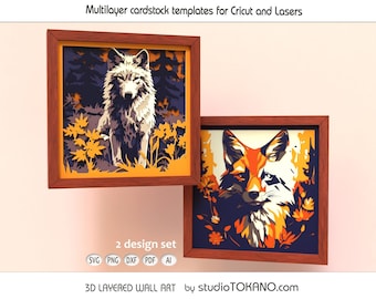 Op de afbeelding: Twee vierkante houten lijsten met meerlaagse kartonnen sjablonen voor Cricut en lasers. De ene lijst toont een wolf in een bos, de andere een vos. De tekst bevat Multilayer cardstock templates for Cricut and Lasers, 2 design set, SVG PNG DXF PDF AI en 3D LAYERED WALL ART by studioTOKANO.com.