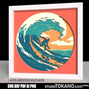 May include: A 7-layer cardstock multi-layer papercraft design of a surfer riding a wave. The design is in a circle with a red background and a white frame. The text "SVG DXF PDF AI PNG" and "STUDIOTOKANO.com ©2024" is at the bottom of the image.
