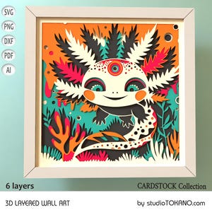 Puede incluir: Una obra de arte mural 3D en capas enmarcada con un diseño de ajolote colorido. La obra utiliza múltiples capas para crear profundidad, con colores vibrantes como naranja, turquesa, rosa y negro. El texto "6 layers" y "3D LAYERED WALL ART" son visibles.