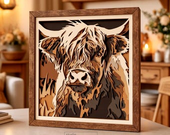 May include: A square, multi-layered wooden wall art piece featuring a detailed cutout of a Highland cow. The artwork uses various shades of brown, cream, and tan to create depth, all enclosed in a dark wood frame. The text "studio TOKANO" is visible.