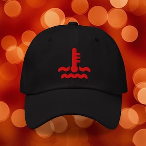 May include: Black baseball cap with a red embroidered design of a thermometer above wavy lines. The cap has a curved brim and a fabric strap closure. The design is centered on the front of the cap.