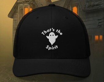 May include: Black trucker cap featuring a white embroidered ghost and the words "That's the Spirit." The cap has a mesh back and a curved peak. The design is on the front of the cap.