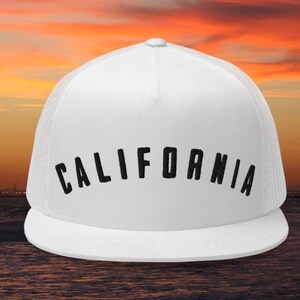 May include: White trucker hat with a black embroidered "CALIFORNIA" text.