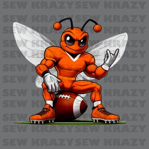 May include: An orange cartoon bee character with a football theme. The bee is muscular, wearing a football uniform, and sitting on a brown and white football. The bee is giving a rock-on hand gesture. The background is gray with the text "SEW KRAZY".