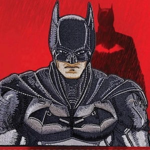 May include: Embroidered patch featuring Batman in a detailed, dark gray and black design. The patch showcases Batman's cowl, chest emblem, and cape against a red background, with a shadow of Batman visible.