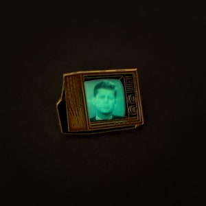 Woodgrain Television Glow In The Dark Enamel Pin with Pre-Installed &quot;JKF&quot;