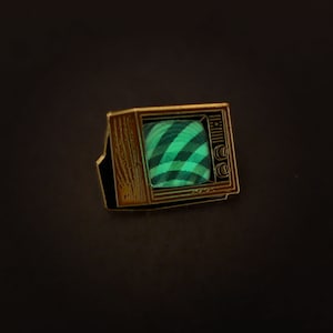 Woodgrain Television Glow In The Dark Enamel Pin with Pre-Installed &quot;Mysterious Swirls&quot;