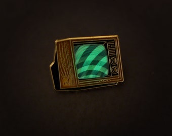 Woodgrain Television Glow In The Dark Enamel Pin with Pre-Installed "Mysterious Swirls"
