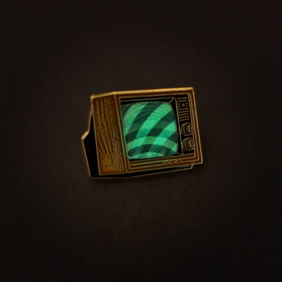 Woodgrain Television Glow In The Dark Enamel Pin with Pre-Installed &quot;Mysterious Swirls&quot;