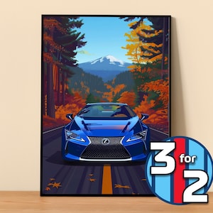 May include: A framed art print featuring a blue sports car driving on a road through a forest with autumn foliage. A mountain is visible in the background under a blue sky. The print includes a circular graphic with the text "3 for 2".