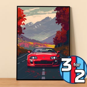 May include: A red sports car drives down a winding road through a mountain pass with fall foliage on either side. The car has a black front bumper and black wheels. The road is paved and has a white line down the center.
