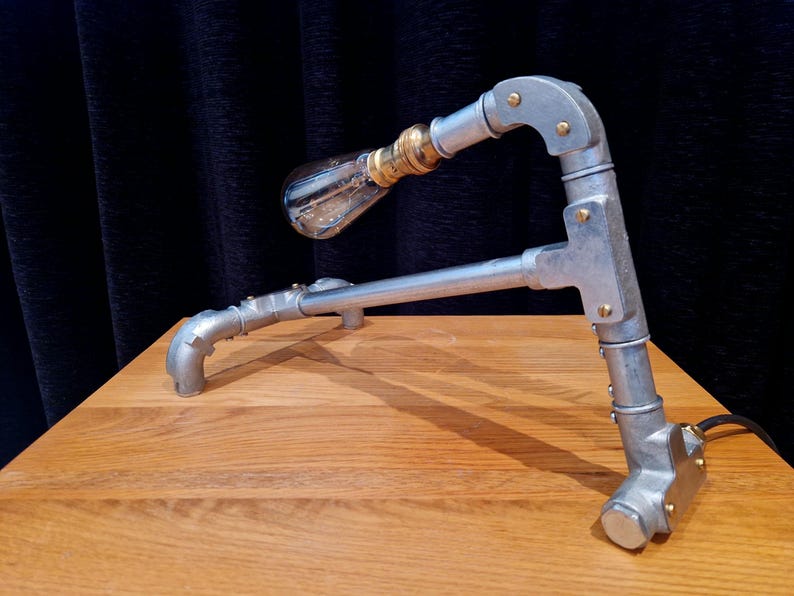 Mechanical style steampunk inspired industrial lamp made from galvanised steel pipe