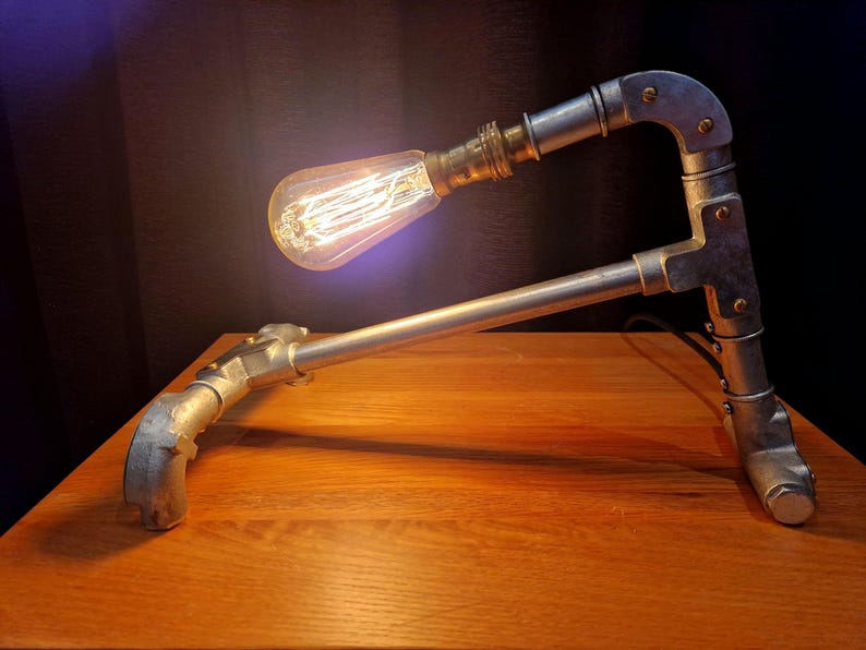 Mechanical style steampunk inspired industrial lamp made from galvanised steel pipe