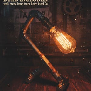 Bulb Included Image Vintage Edison bulb included with handmade industrial pipe lamp, retro steel desk lighting for urban home decor and cinematic interior aesthetics.