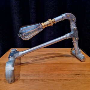Mechanical style steampunk inspired industrial lamp made from galvanised steel pipe