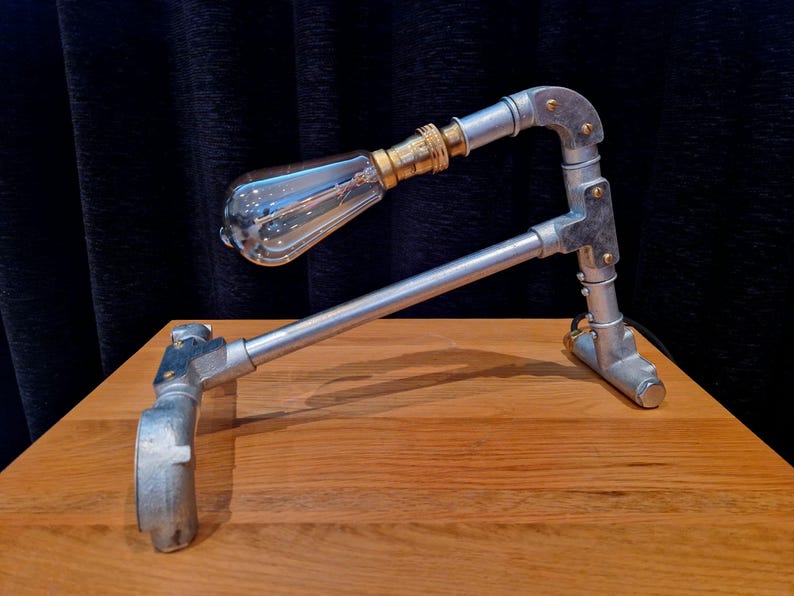 Mechanical style steampunk inspired industrial lamp made from galvanised steel pipe