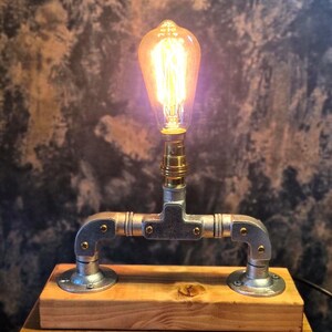 A minimalist industrial /able lamp with brass lampholder made from galvanised steel