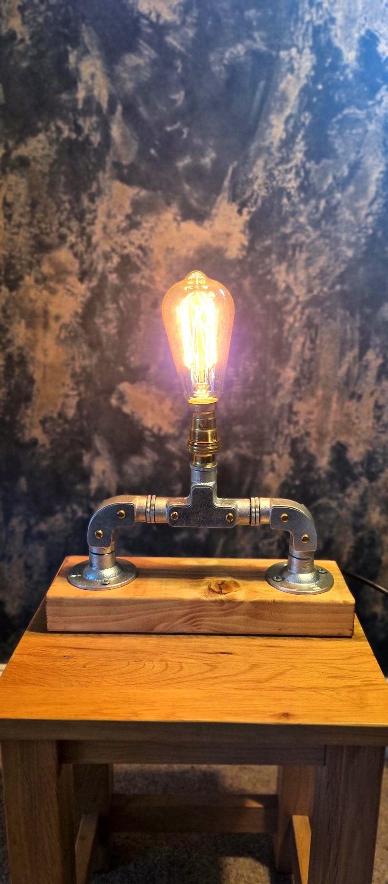 A minimalist industrial /able lamp with brass lampholder made from galvanised steel