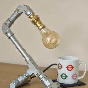Handmade industrial lamp, perfect for modern home decor, featuring galvanized steel, brass