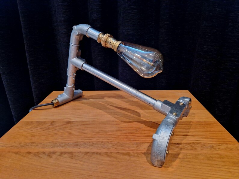 Mechanical style steampunk inspired industrial lamp made from galvanised steel pipe
