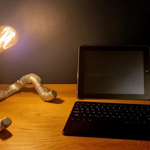 Handcrafted lamp on a desk in a moody style