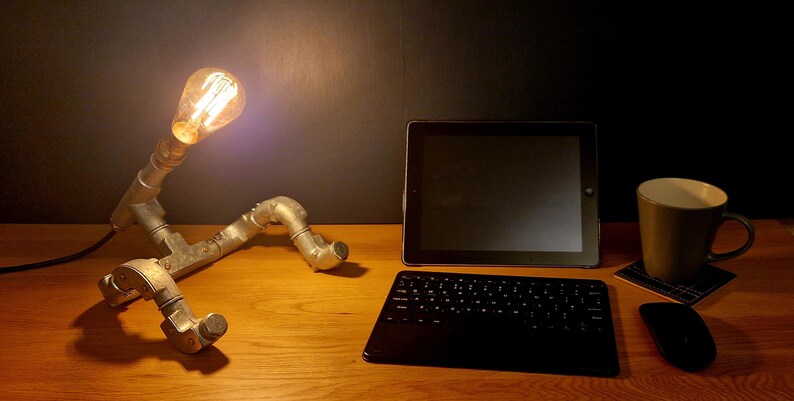 Handcrafted lamp on a desk in a moody style