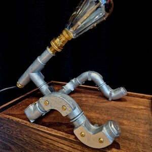 Industrial lighting gift showing the robot lamp, included LED bulb, professionally made