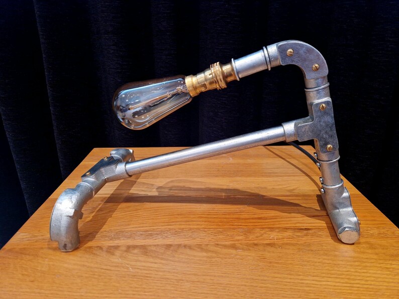 Mechanical style steampunk inspired industrial lamp made from galvanised steel pipe