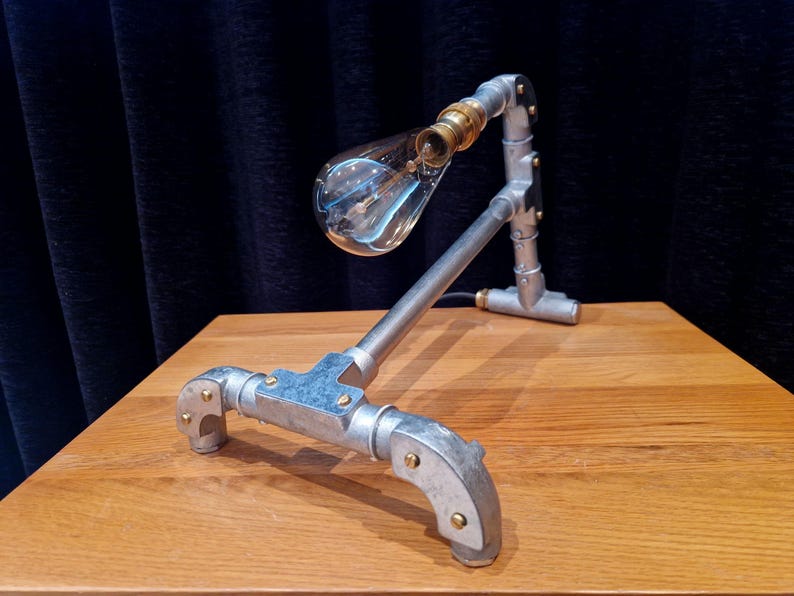 Mechanical style steampunk inspired industrial lamp made from galvanised steel pipe
